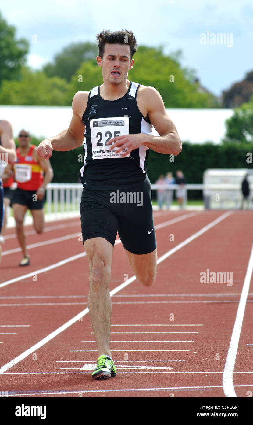 Runner finishing in men`s 400m race Stock Photo